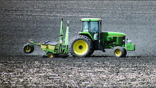Staff Photo by Byron Higgin. On Tuesday farmers tried to get into the field. This one planting was on the Moorse farm just southwest of Minneota.