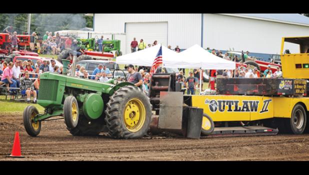 Mascot photo by Reba Lipinski Jason Epple of Minneota participates in the Antique Tractor Pull on Saturday.