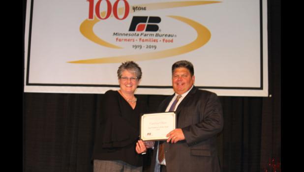 Special Photo. Carolyn Olson with MFBF President Kevin Paap, right.