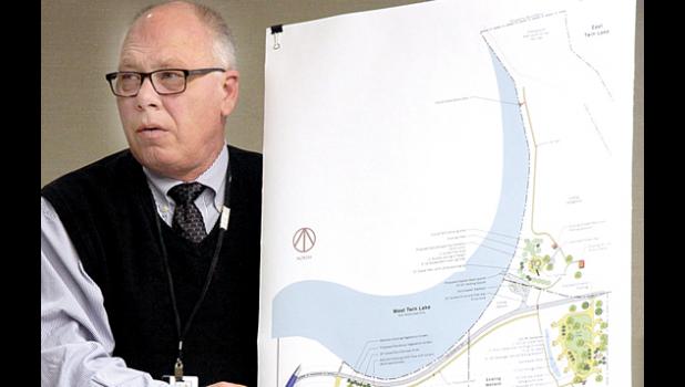 Staff Photo by Byron Higgin. Commissioner Steve Ritter goes over the park plan with the board.