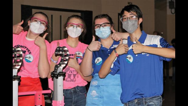 Contributed photo. Human player Emma Lipinski, third from left, and Driver Sam Skorczewski, right, pose for a photo with team members from 2177 The Robettes.