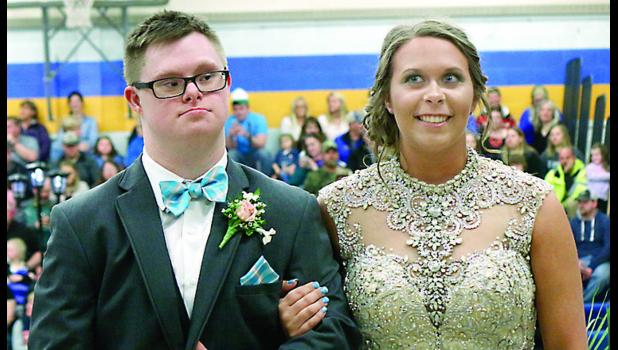 Staff Photo by Byron Higgin. Ross and Laura looked sharp at the Grand March.