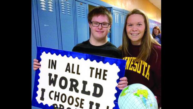 Special photo. Ross asked Laura to Prom with this sign and globe.