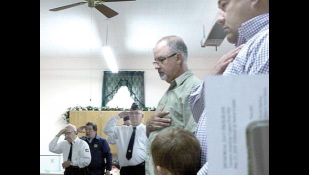 Staff Photo by Byron Higgin Chris Swedzinski and son plus Jeff Van Keulen paid their respects.