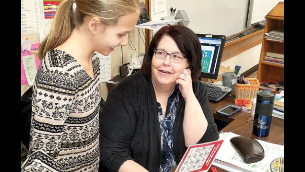 Staff photo by Cherri Schmig. Teacher Mary Ann Horner talked with Natalie Ratajczak about the Scavenger Hunt.