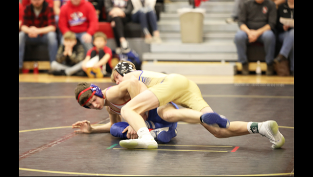 Photo for the Mascot by Laura Buysse. Peyton Gillund, right, tries to turn Alexander Schuh of Tracy-Milroy- Balaton/Westbrook-Walnut Grove in their 113-pound match on Saturday. Gillund won 12-9.