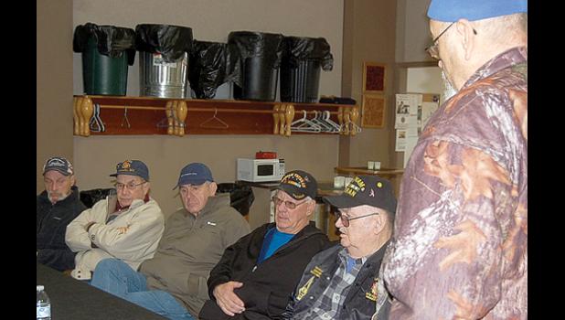 Staff Photo by Byron Higgin. Discussing the situation was Jim Fink, right along with (left to right) Mike Sontag, Omar Laleman, Gary Buysse, Ed Lozinski and Tom Hovland. Staff Photo by Byron Higgin.