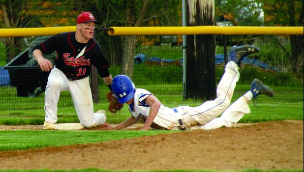 Staff Photo by Byron Higgin Austin Sorensen doubled home a run but was out at third trying to stretch it into a double. LqPV's Wyatt Halvorson made the putout.