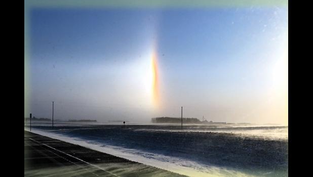 Staff Photo by Byron Higgin. As temperatures struggled to stay above zero on Saturday, bright "sun dogs" were visible in the open areas. This photo was taken around 9 a.m. outside of Minneota.