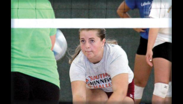 Staff Photo by Byron Higgin. With her eye on the ball, Sydney Larson hit it back toward the net and kept watching. She will be one of the front-line girls expected to help the Vikings this year.