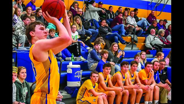 Photo by Brian Jeremiason. Tristan Sorensen sank three-straight, three-pointers in the first half.