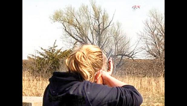 Staff Photo by Scott Thoma. Ribe shattered the target (upper, right) during a recent shoot.