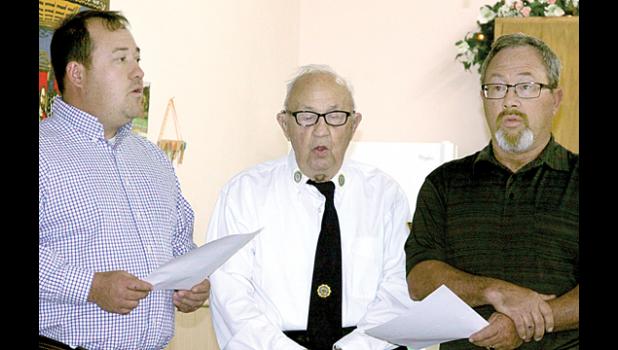 Staff Photo by Byron Higgin The Swedes (Chris, Tom and Kevin Swedzinski) sang.
