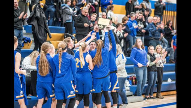 Photo for the Mascot by Brian Jeremiason. The Vikings celebrate receiving the 2020 Camden Conference Championship Trophy.