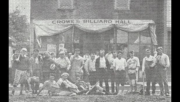 Photo Courtesy of the Lyon County Museum. The 1920 Globe Land and Loan Company of Minneota baseball team poses in front of Crowe's Billiard Hall.