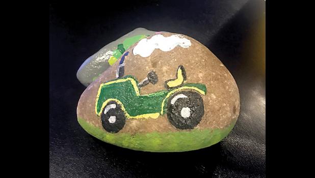Special photo. This rock is worth money, if you find it!. Turn it in to KB’s Bar and Grill, have your picture taken and win the cash.