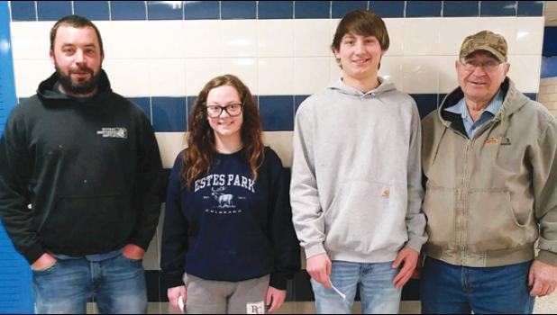 Contributed photo VFW members Tony Buysse left, and John DeSmet, right, pose with the VFW Scholarships winners Mya Lozinski and Truman Wambeke.