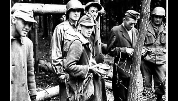 Special Photo. Virgil Ufkin was a soldier with prisoners of war (back, second from left) during World War II.