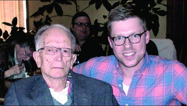 Staff Photo by Byron Higgin. Virgil Ufkin with grandson Tony.