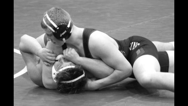 Mascot photo by Mindy FIer Noah Gorecki pinned Carter Evans of West Central in the first period at the West Lyon (Iowa) Invitational on Saturday.
