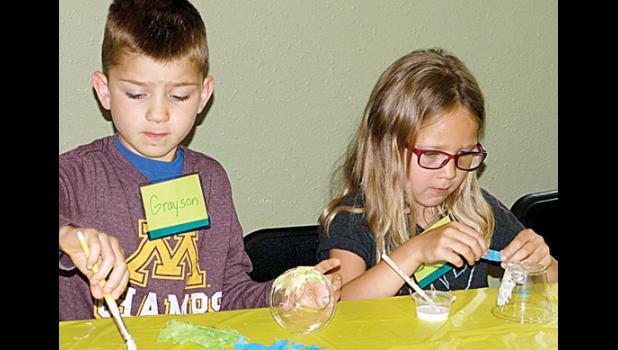 Photo for the Mascot by Sue Jacobson. Working on their crafts were Grayson and Hadley Jurrens.
