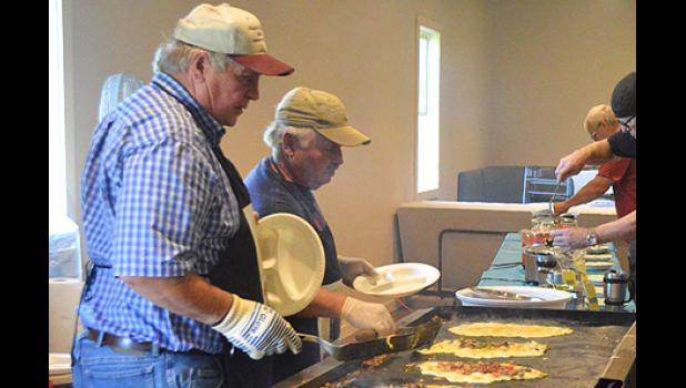 Special photo. John Noyes, and Bob Merritt helped make omelettes.