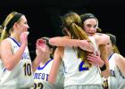 Abby Hennen got a hug from teammate Morgan Kockelman, as Hennen's sister Morgan (left) came to join the celebrations.