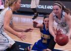 Minneota's Abby Hennen went to the floor to fight for the ball against Lyle-Pacelli.