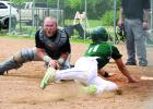 Austin Buysse (right) slid into home in the fourth inning, but a throw from left field was in time and Hancock catcher Austin Steege made the tag.