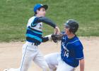 Minneota infielder Josh Schuelke forces a Lakeview runner out at second base before relaying a throw to first base in an attempt at a double play. 
