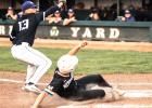 Kellen Bradley scores from third base on a wild pitch as Murray County Central pitcher Dylan Kluis awaits the throw from the catcher. 