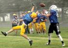 Blake Reiss went high to deflect the ball away from his Tracy-Milroy-Balaton opponent in the scrimmage Saturday at Tracy.