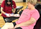 Pam Hennen donates blood at the American Legion last Wednesday. 