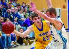 Nolan Boerboom, who scored 17 points, passed the ball past RTR's Carter Hansen.