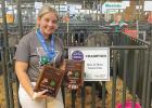 Brooke Moorse achieved a rare "Triple Crown" win at the State Fair on Friday with her dairy goat, Flirtini. 