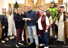 Emily Hennen, coordinator of the Minneota Area Mission Trip, and, other members of the mission group, received a check from Boxelder Bug Days chairpeople Scott and Roberta Josephson for $1,064.