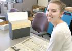 Carissa Hansen went through the files, including old Minneota Mascots, in an effort to learn more about Bill Holm. 