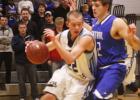 Russell-Tyler-Ruthton’s Carter Hansen drove the ball toward the basket as Central MN Christian’s Austin Marcus tried to stop him. Hansen’s father Jeff is a former Minneota teacher and softball coach. 