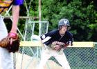 File Photo by Byron Higgin Carter Schuelke led off first base for the Junior Vultures.