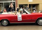 Casey McCoy waves to the crowd during the Quarry Days parade recently in Dell Rapids, SD. 