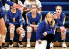 Coach Hayley Fruin and players Reese Gillund and Ireland Stassen watched the action in the conference championship against MACCRAY Monday night.