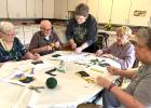  Okrina, center, helps residents with their project. Left to right: Joyce Carpenter, Sam Waldner, Sandy Thompson, and Susan Fischer.