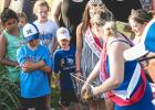 Onlookers watch as 2020 Boxelder Bug Days queen Brooke Moorse nets one of the ducks from the water as First Princess Ellen Meagher and Second Princess Morgen Wersal assist. 