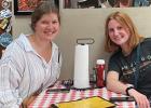Kate Hennen, left, and 2022 FCCLA officer and gold medal winner, enjoys lunch at the Kansas City BBQ with Natalie Bot, a five-time national winner from Minneota who was a judge at this year's national convention. The Kansas City BBQ is where notable scenes from the original Top Gun movie were filmed. 