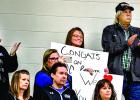 Lydia Sussner's mother Nacole held a sign signifying the accomplishment as her grandparents Joyce and Fuzzy Downing applauded.