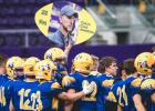 Minneota players celebrate Johnston’s 200th career win after the championship game,