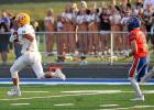 Minneota Vikings tight end Brock Fier races downfield after catching a pass from Tristen Sussner and scoring on a 77-yard play in the first quarter Friday night in Canby. 