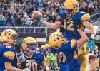 Zack Fier is hoisted in the air by Anthony Rybinski after scoring a touchdown. 