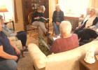 Members of the GetTogether Club met at the home of Karen Golden for its Spring Party in May. Secretary-treasurer Audrey Timm reads off the names for roll call. 