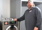 ent Fire Chief Cory Crowley shows the recently installed dryer and extractor that the Ghent Fire Department was badly in need of. 
